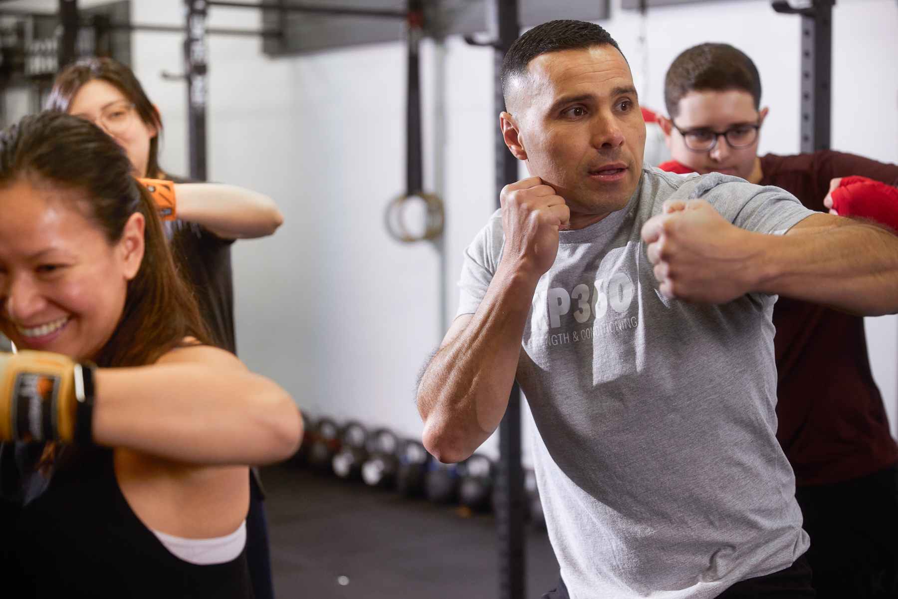Coach teaching boxing fundamentals at XP360 Boxing Academy
