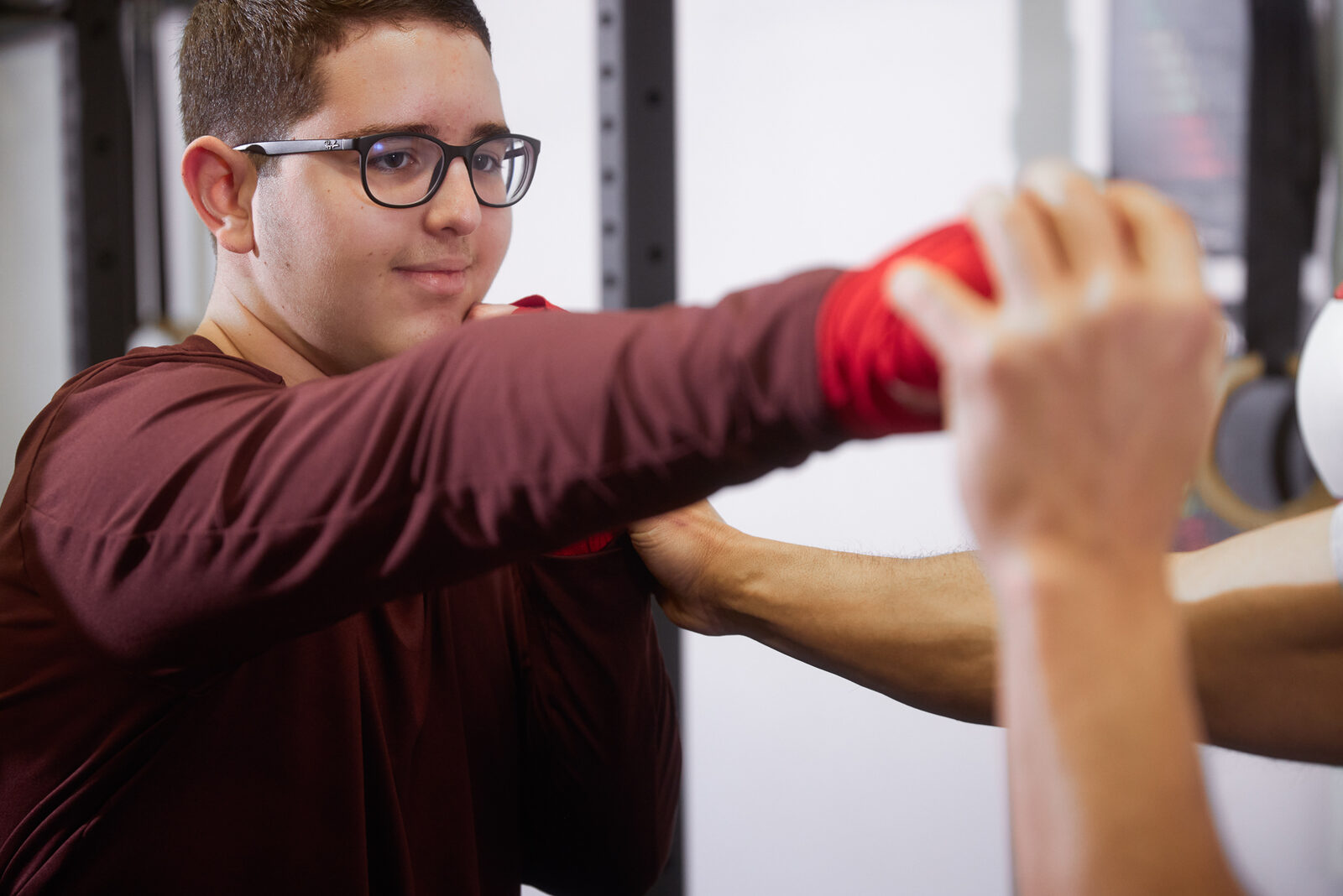Class practicing jab and cross punches in a line